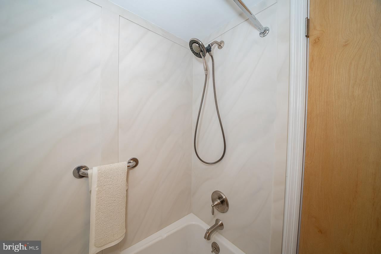 1219 West Wynnewood Road, Unit 415 Wynnewood, PA 19096 - Photo 30 of 57 Hall Bathroom Tub with Shower