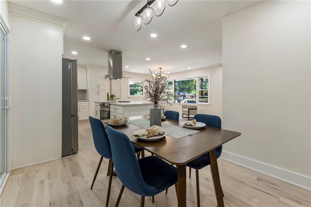 1690 Carter Road Decatur, GA 30032 - Photo 12 of 49 a view of a dining room with furniture and wooden floor
