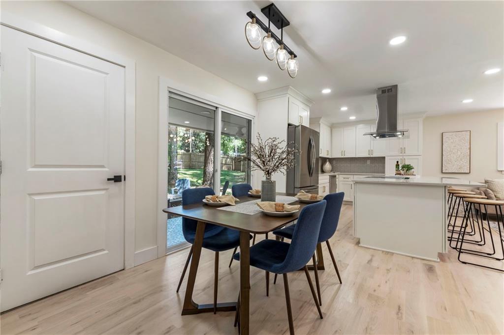 1690 Carter Road Decatur, GA 30032 - Photo 14 of 49 a view of a dining room with furniture and wooden floor