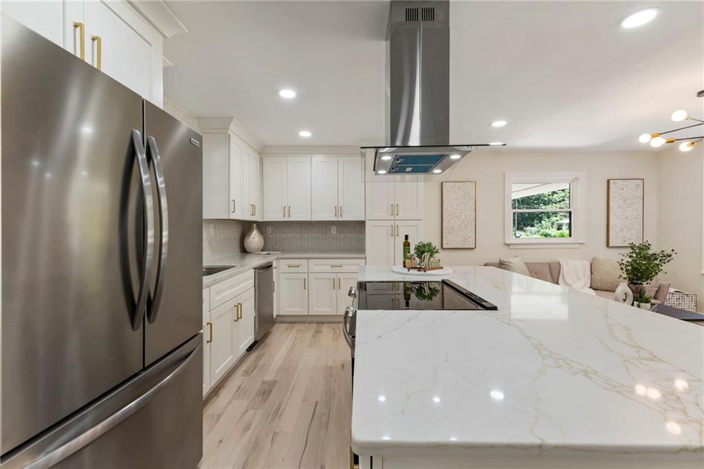 1690 Carter Road Decatur, GA 30032 - Photo 18 of 49 a kitchen with refrigerator a sink and cabinets
