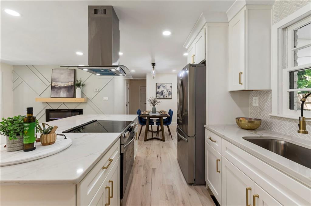 1690 Carter Road Decatur, GA 30032 - Photo 22 of 49 a kitchen with a sink appliances and cabinets