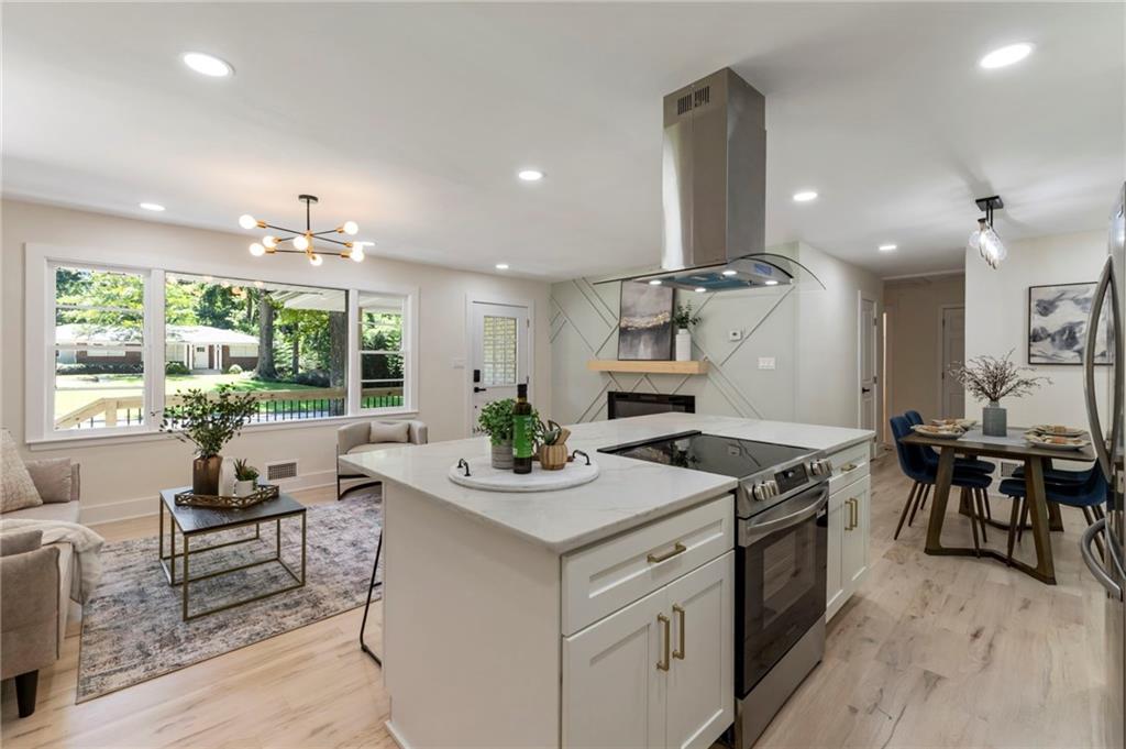 1690 Carter Road Decatur, GA 30032 - Photo 23 of 49 a kitchen that has a stove and a table in it