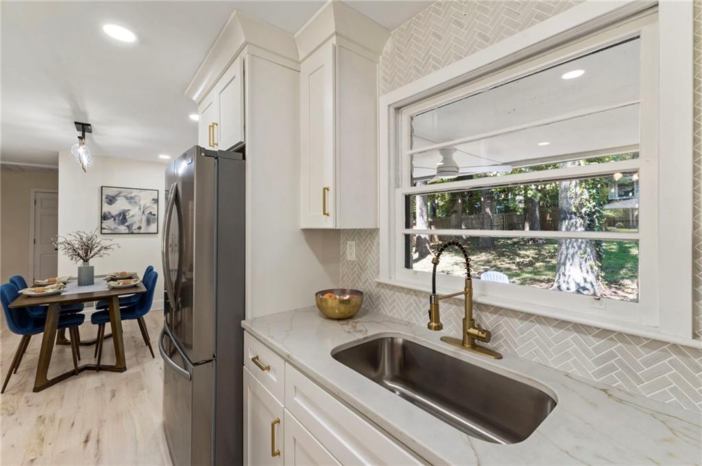 1690 Carter Road Decatur, GA 30032 - Photo 24 of 49 a kitchen with a sink a counter top space and appliances