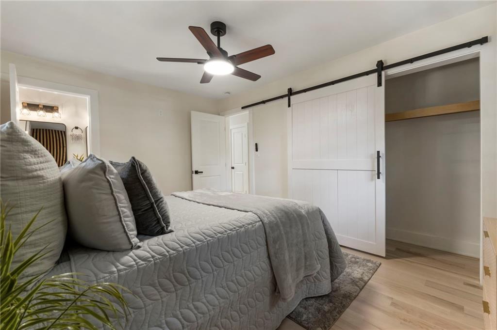 1690 Carter Road Decatur, GA 30032 - Photo 28 of 49 a bed room with a bed and a ceiling fan