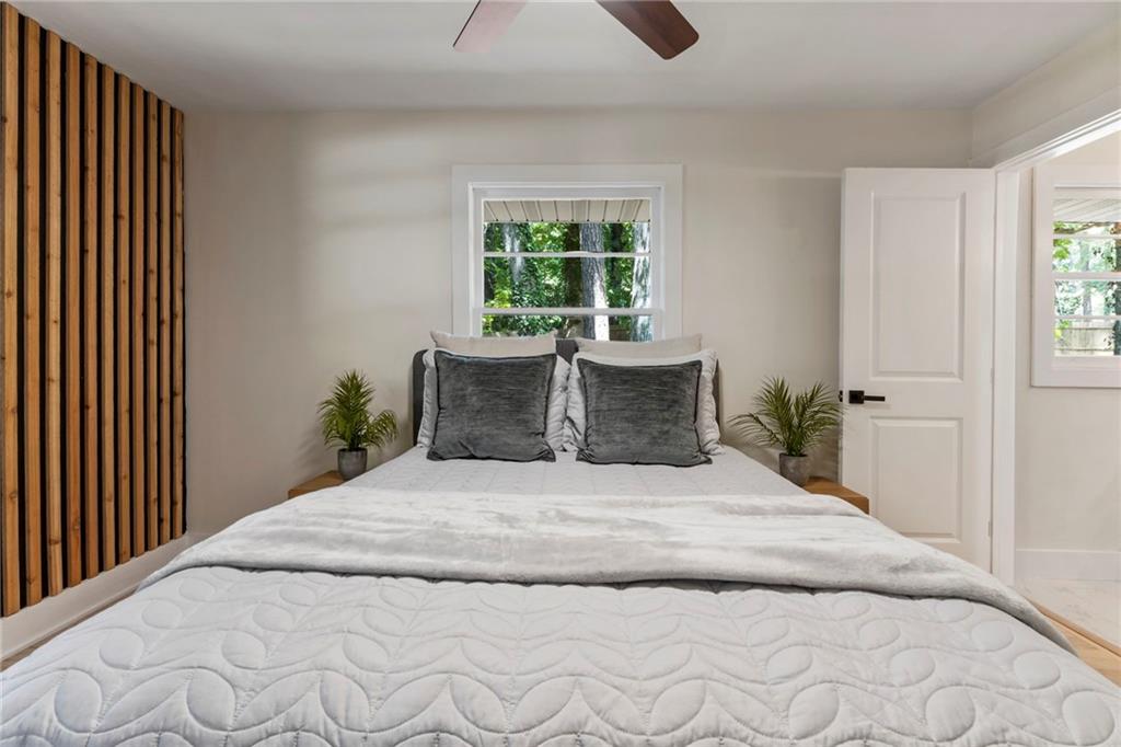 1690 Carter Road Decatur, GA 30032 - Photo 30 of 49 a large bed sitting in a bedroom next to a window