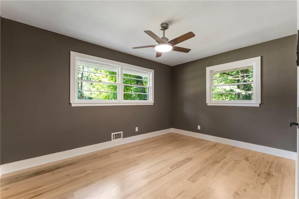 1690 Carter Road Decatur, GA 30032 - Photo 35 of 49 a view of a big room with wooden floor and windows