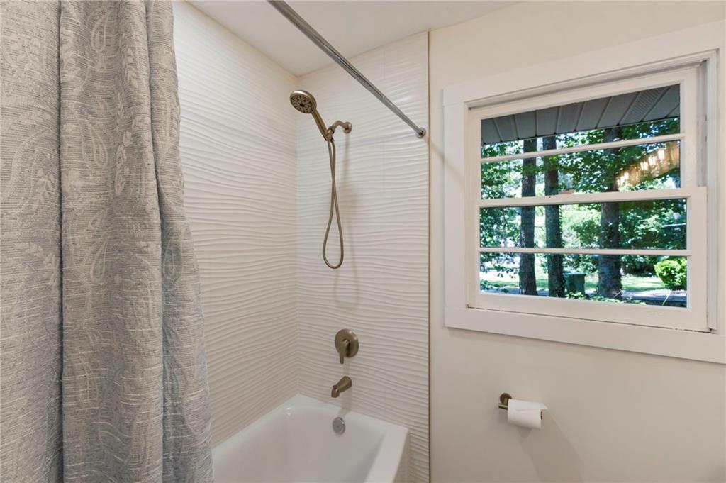 1690 Carter Road Decatur, GA 30032 - Photo 41 of 49 a bathroom with a bath tub with a shower