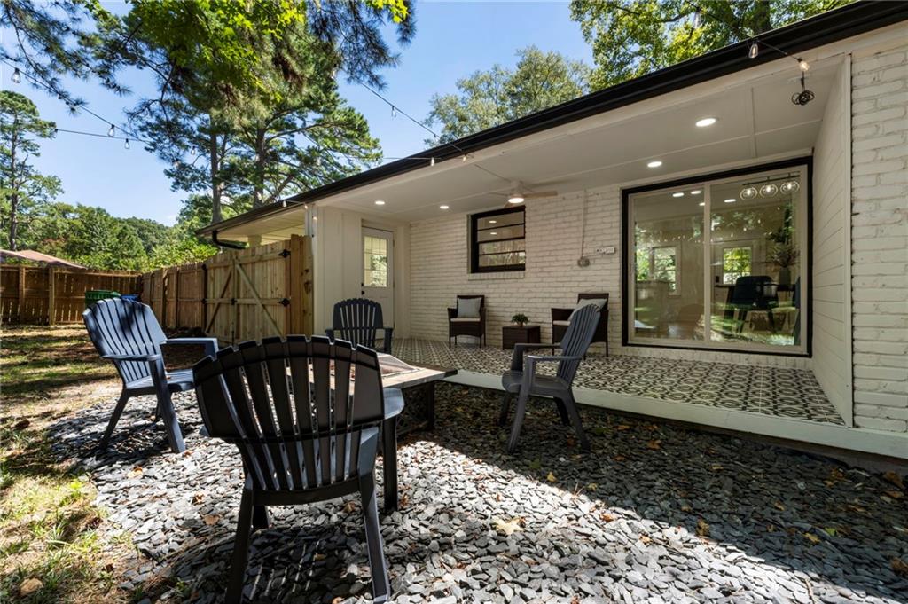 1690 Carter Road Decatur, GA 30032 - Photo 47 of 49 a view of a patio with a table and chairs
