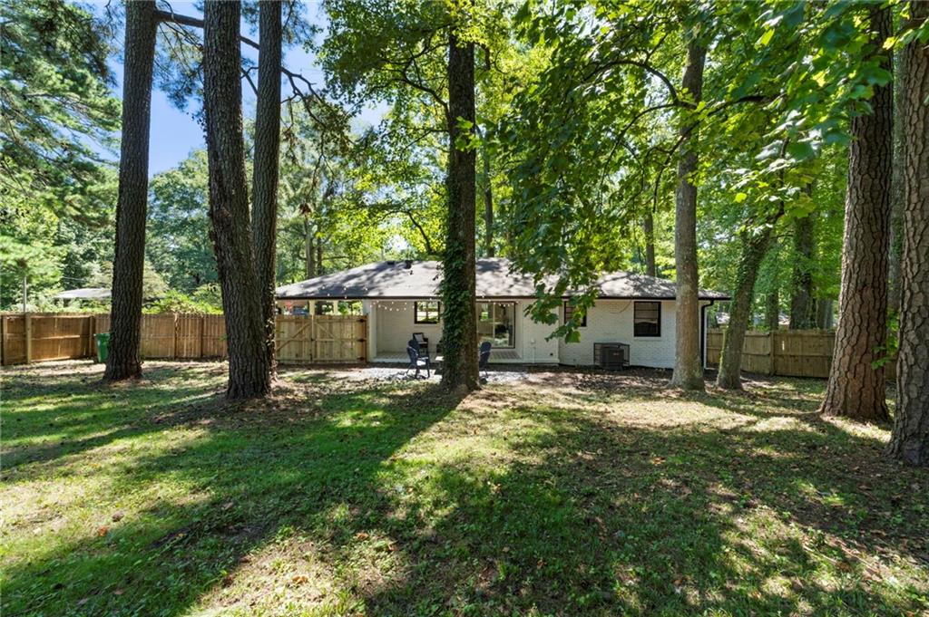 1690 Carter Road Decatur, GA 30032 - Photo 48 of 49 a view of a trees in front of a house with a big yard and large trees