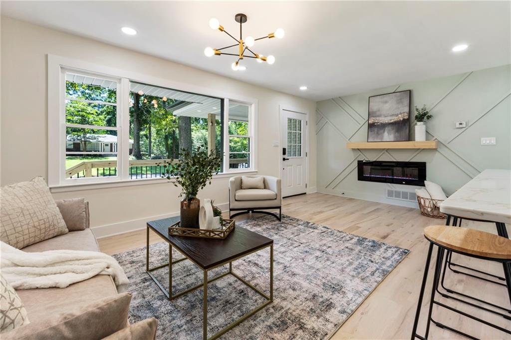 1690 Carter Road Decatur, GA 30032 - Photo 8 of 49 a living room with furniture and a fireplace