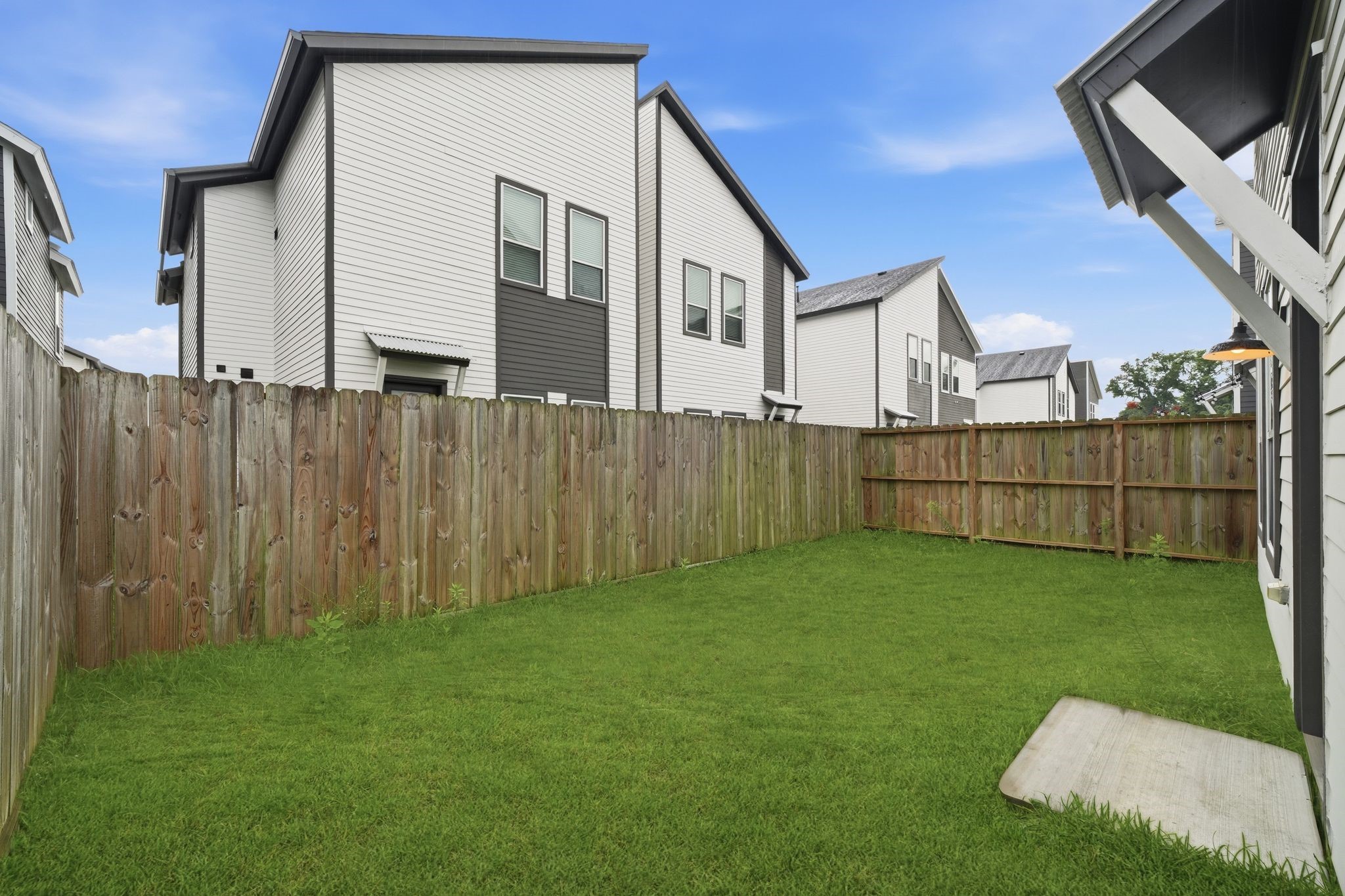 5814 Cebra Street Houston, TX 77091 - Photo 31 of 32 Generous backyard space paired with a modern exterior—perfect for relaxing or entertaining.
