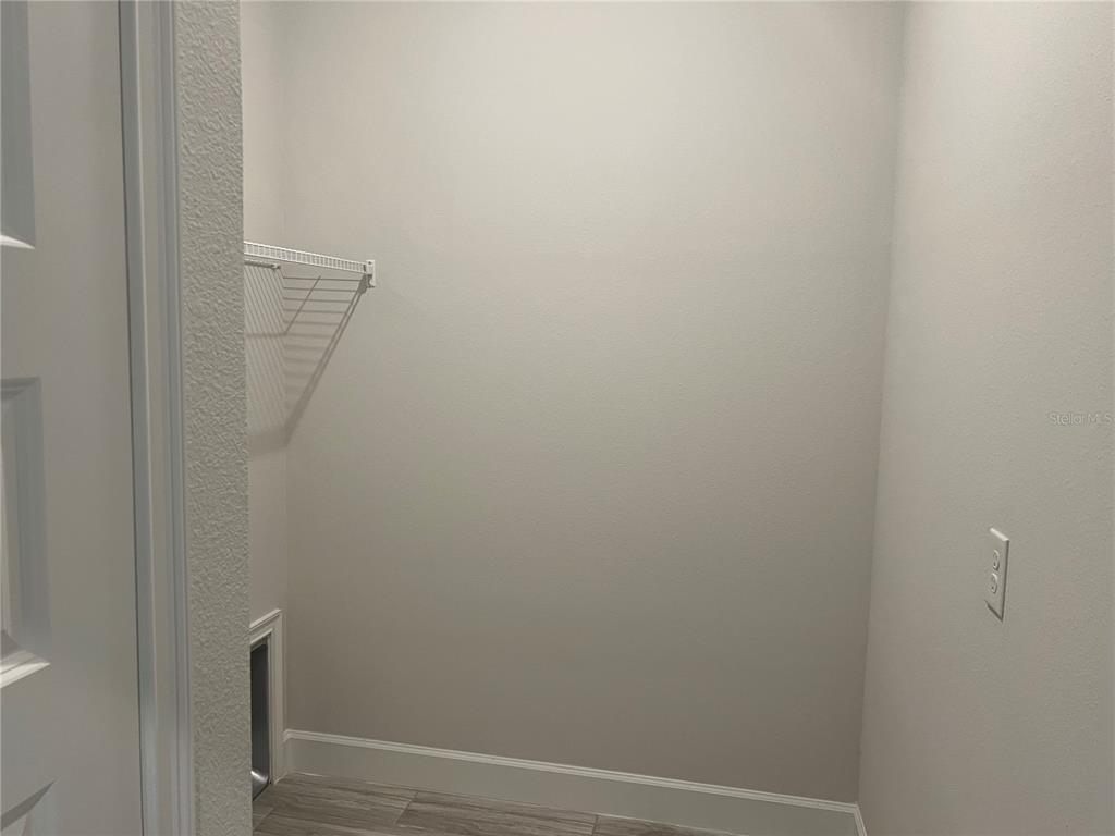 13322 Ogden Glade Road Dade City, FL 33525 - Photo 11 of 24 a view of a hallway