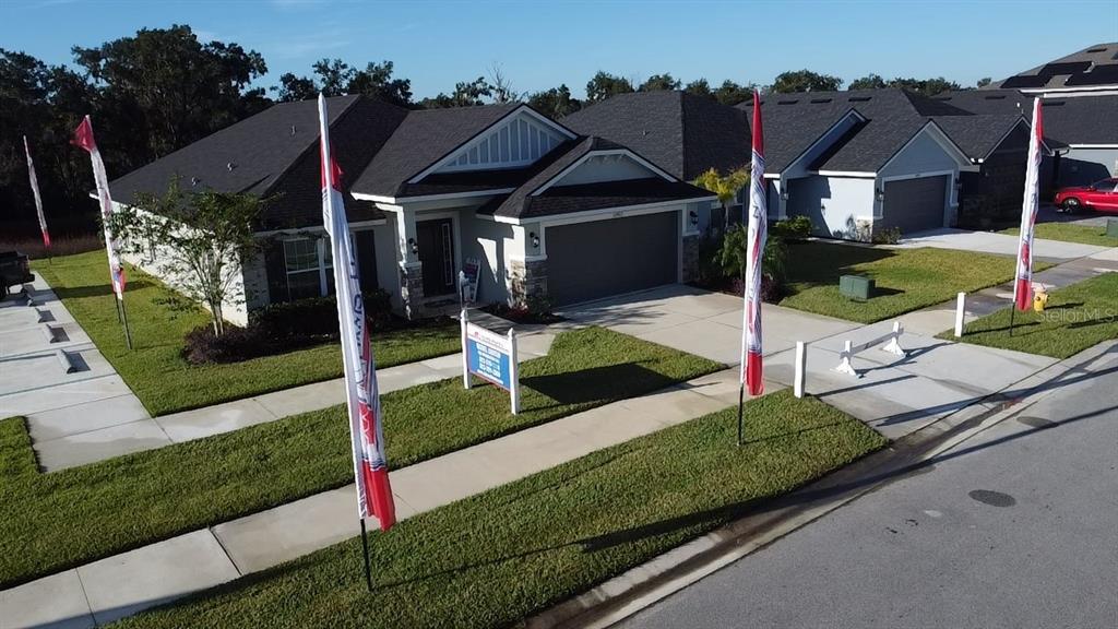 13322 Ogden Glade Road Dade City, FL 33525 - Photo 18 of 24 a front view of a house with garden