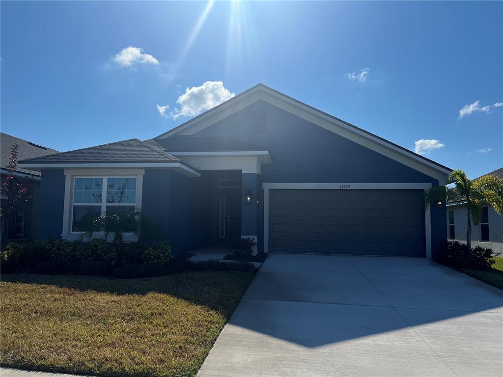 13322 Ogden Glade Road Dade City, FL 33525 - Photo 2 of 24 a view of a house with a yard