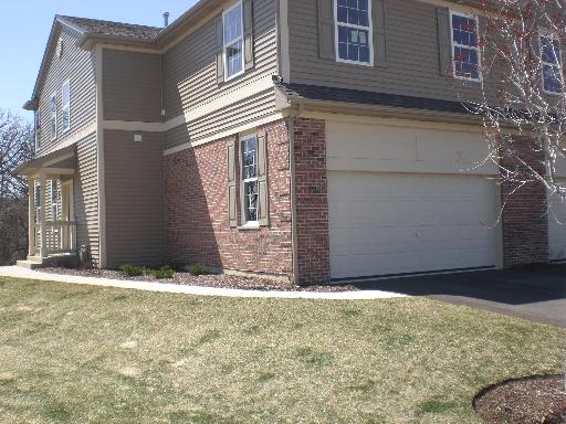 738 Oak Hollow Road, Unit 1 Crystal Lake, IL 60014 - Photo 1 of 1 a view of door with yard