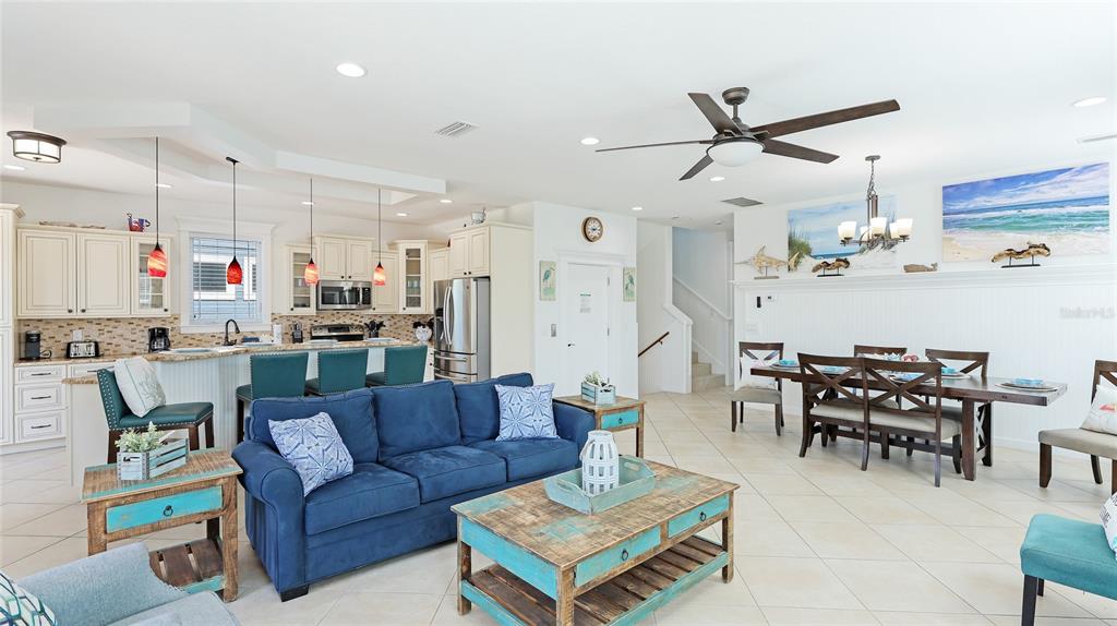 4101 4th Avenue Holmes Beach, FL 34217 - Photo 14 of 60 a living room with lots of furniture and kitchen view