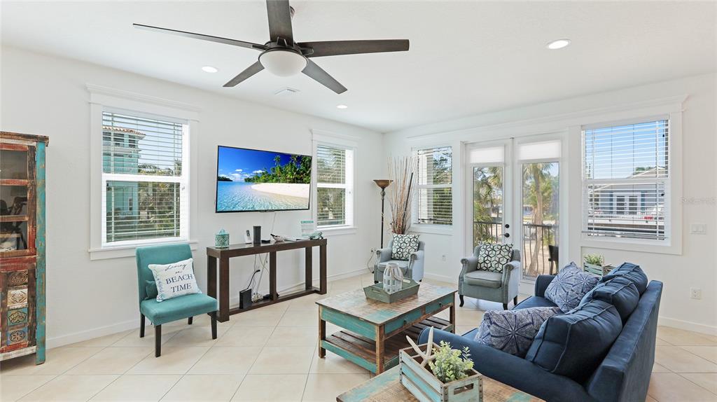 4101 4th Avenue Holmes Beach, FL 34217 - Photo 16 of 60 a living room with furniture and windows