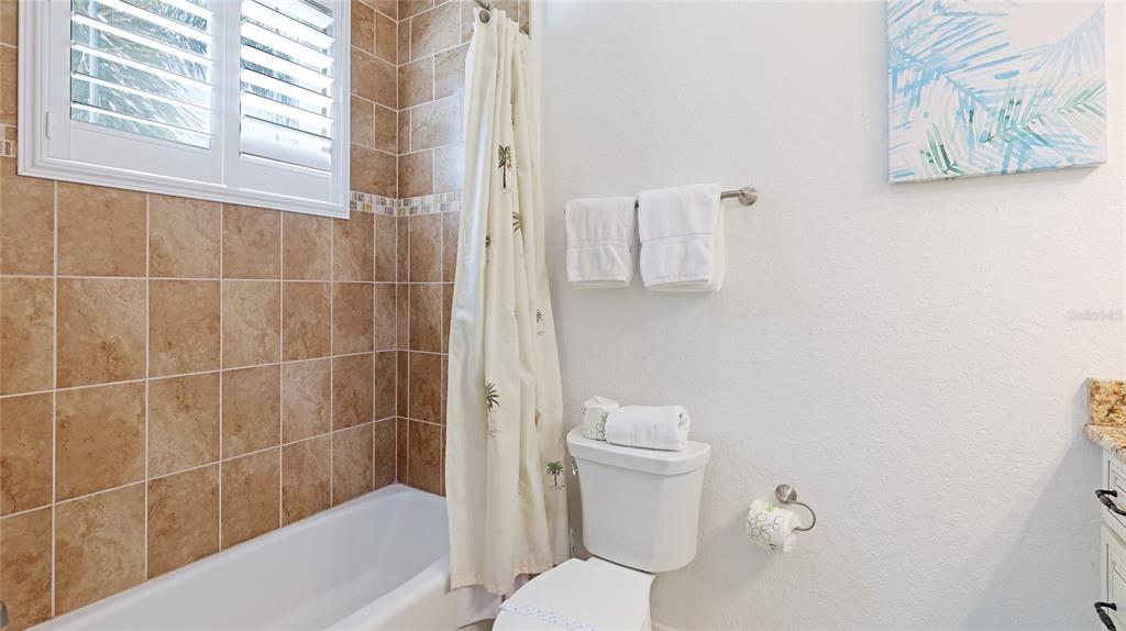4101 4th Avenue Holmes Beach, FL 34217 - Photo 26 of 60 a bathroom with a toilet and a shower