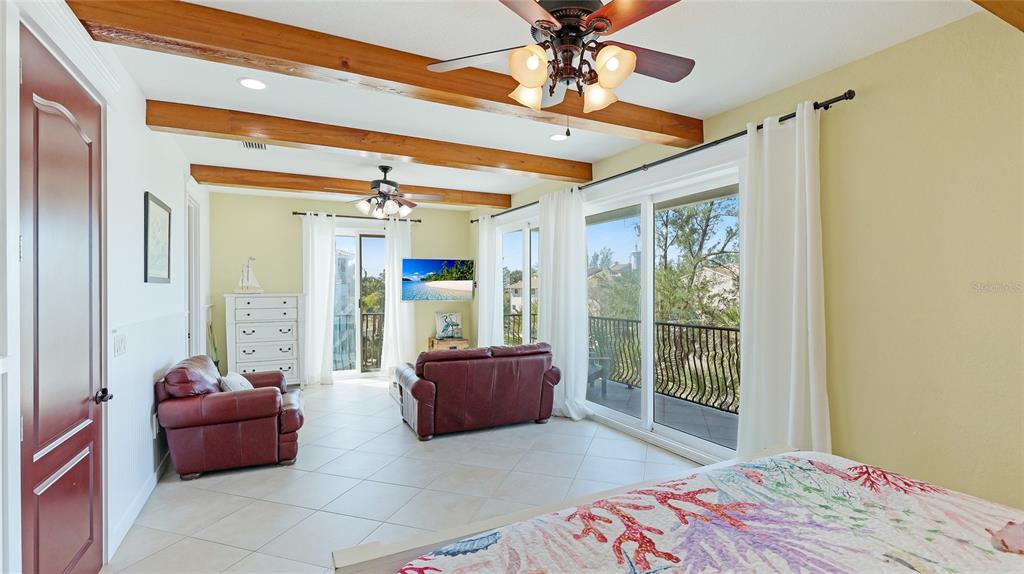 4101 4th Avenue Holmes Beach, FL 34217 - Photo 31 of 60 a living room with furniture and a window