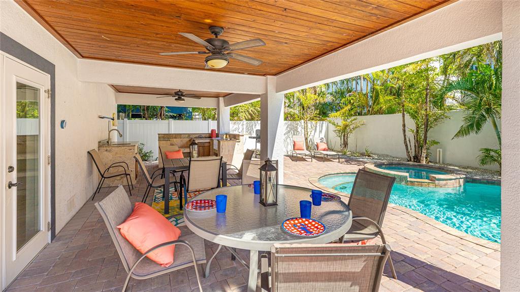 4101 4th Avenue Holmes Beach, FL 34217 - Photo 38 of 60 a view of an outdoor dining space with furniture and garden view