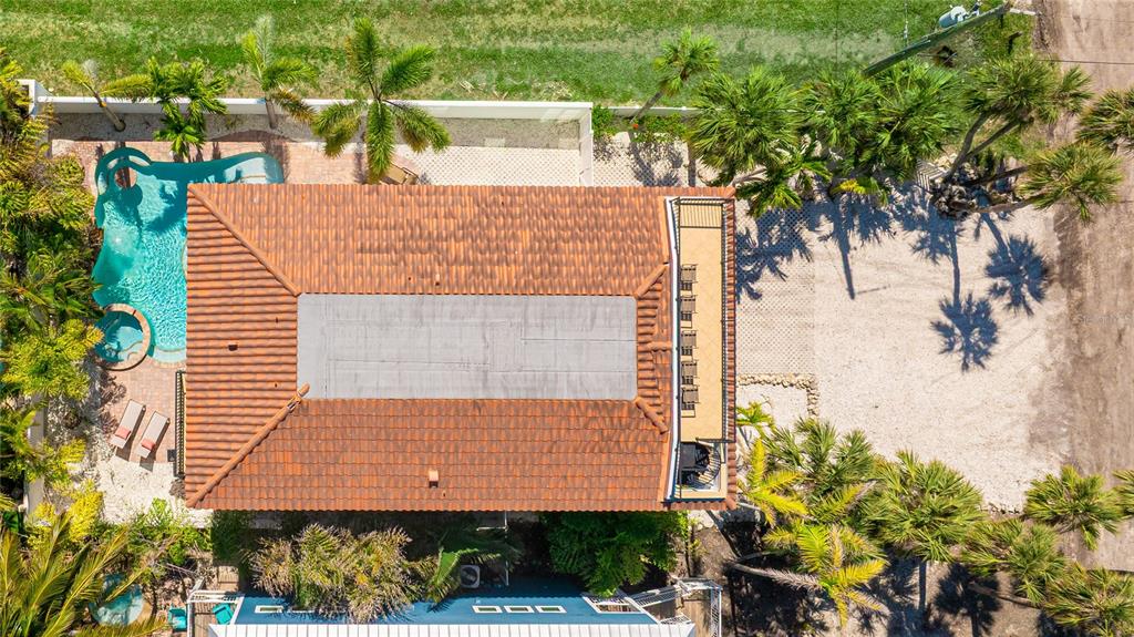 4101 4th Avenue Holmes Beach, FL 34217 - Photo 53 of 60 an aerial view of a house with a yard and potted plants