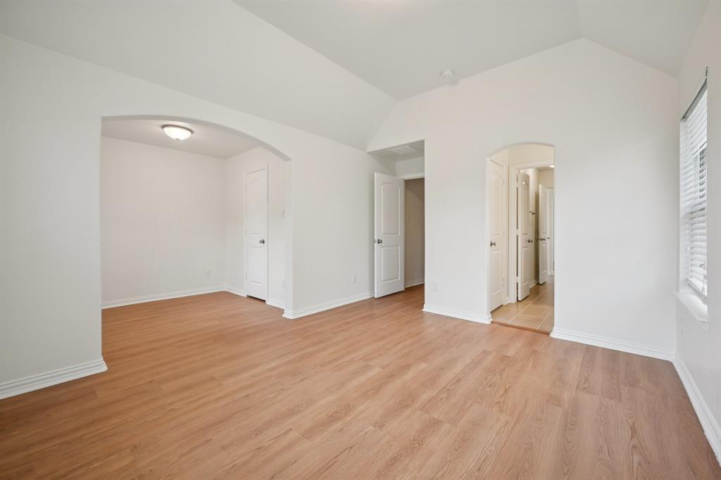 2029 Temperate Drive Allen, TX 75013 - Photo 25 of 40 wooden floor in an empty room with a window