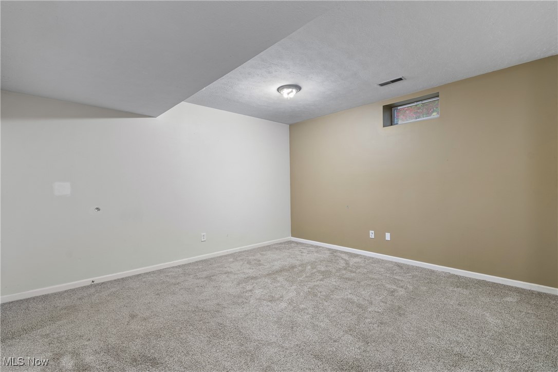 1333 Derbydale Road Akron, OH 44306 - Photo 25 of 29 Bedroom 4, office or playroom with light carpet and neutral paint.