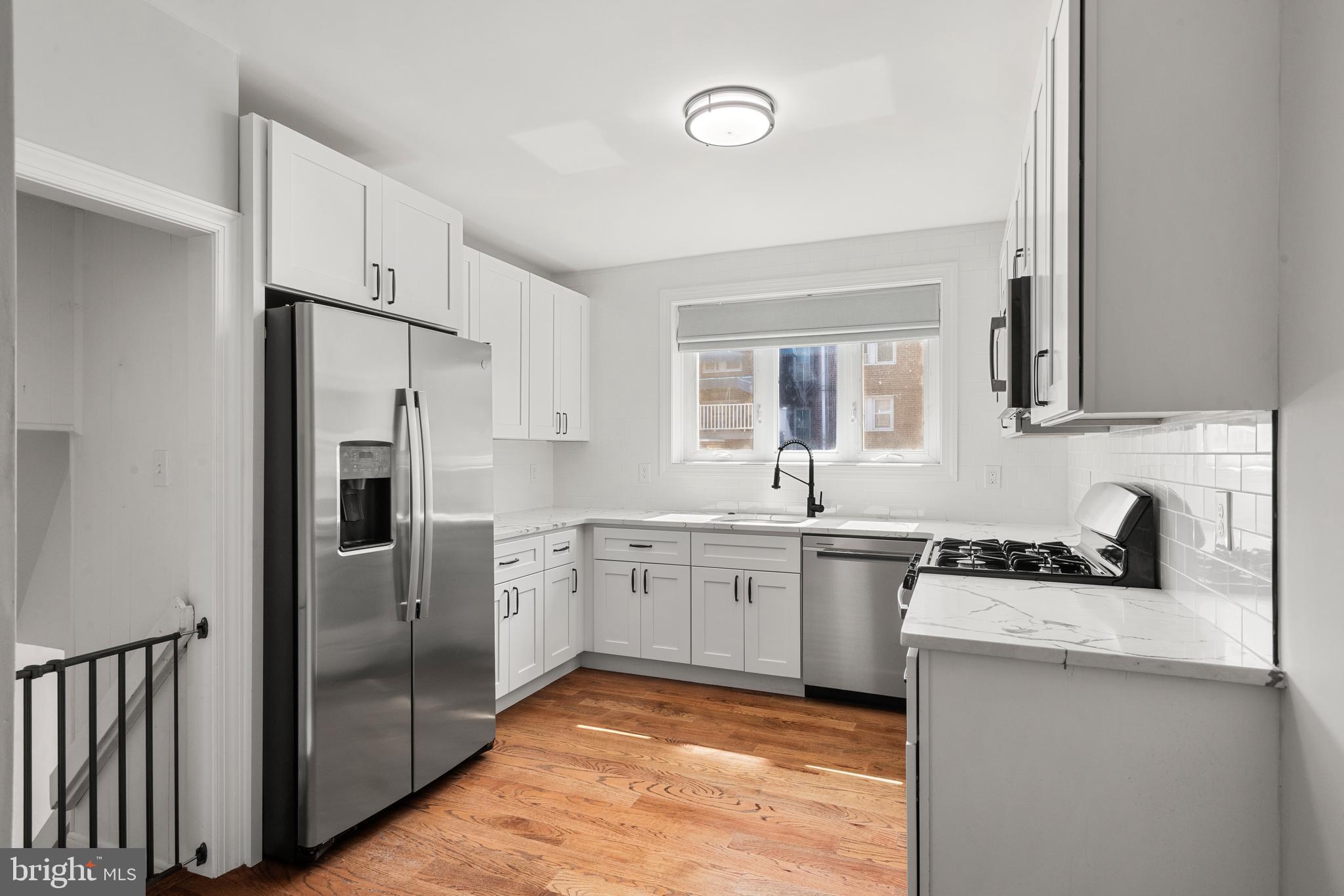 649 Maris Street Philadelphia, PA 19128 - Photo 24 of 28 Kitchen leads to finished lower level