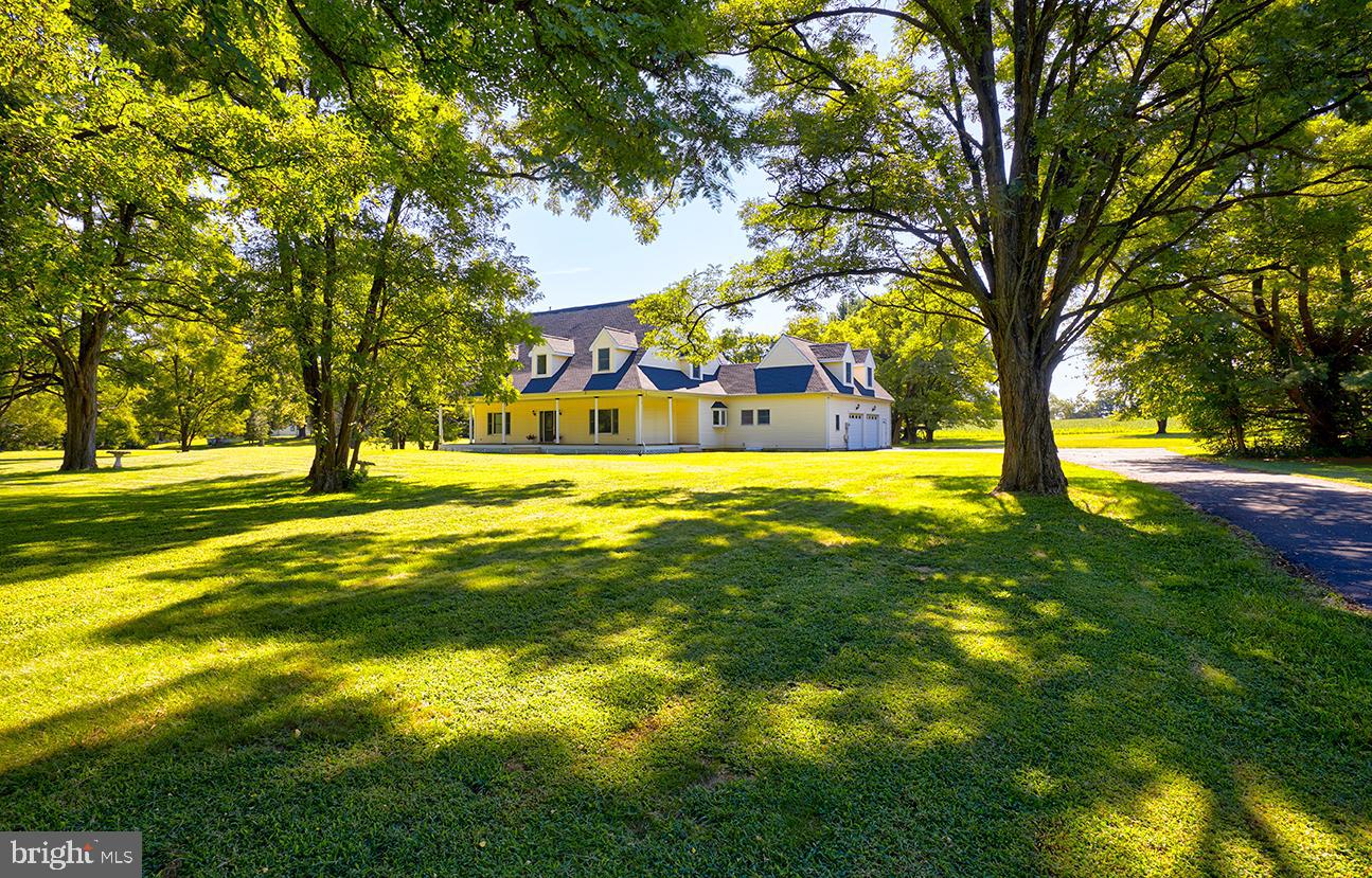 2582 Monmouth Road Jobstown, NJ 08041 - Photo 1 of 65 a swimming pool with trees in the background