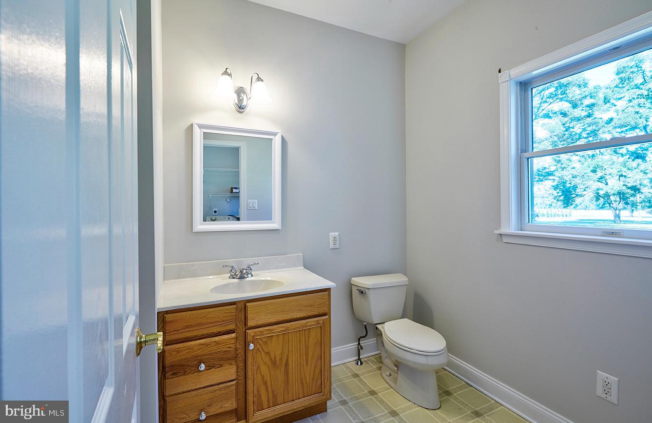 2582 Monmouth Road Jobstown, NJ 08041 - Photo 24 of 65 a bathroom with a toilet sink and mirror