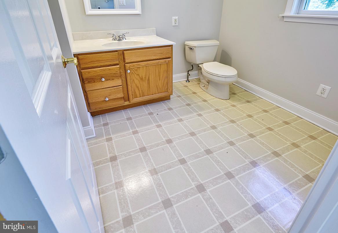 2582 Monmouth Road Jobstown, NJ 08041 - Photo 25 of 65 a bathroom with a sink a toilet and a mirror