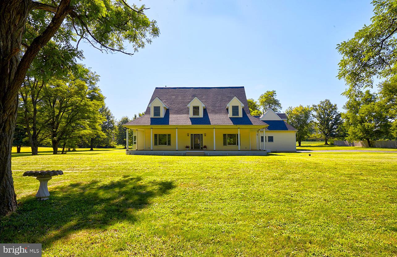 2582 Monmouth Road Jobstown, NJ 08041 - Photo 4 of 65 a front view of house with outdoor space and swimming pool