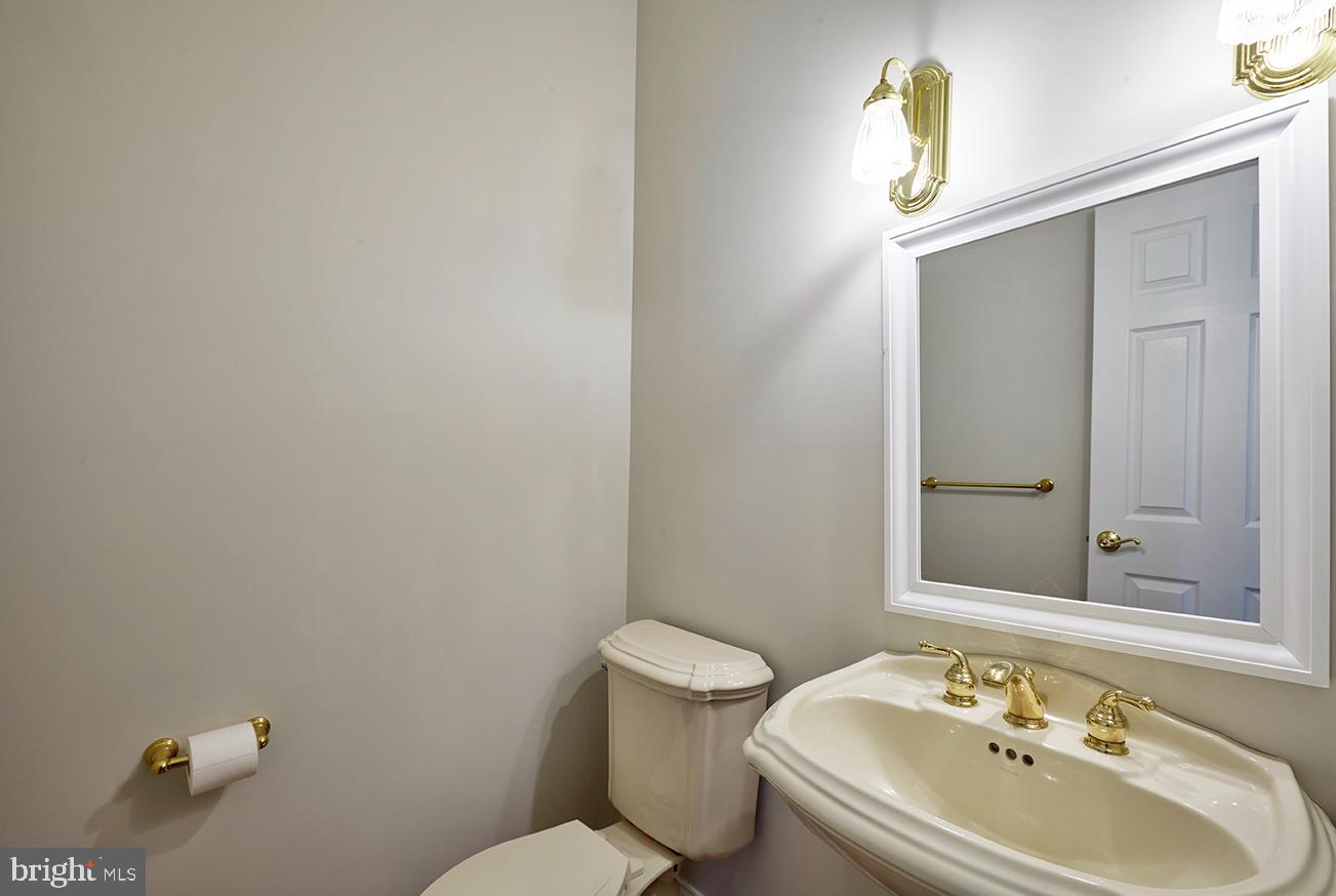 2582 Monmouth Road Jobstown, NJ 08041 - Photo 46 of 65 a bathroom with a sink mirror and toilet