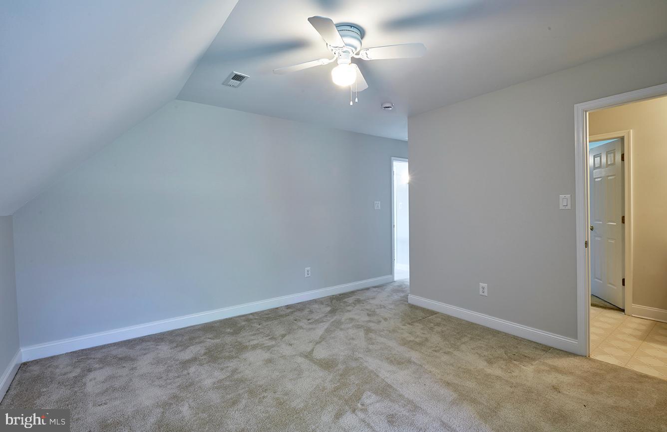 2582 Monmouth Road Jobstown, NJ 08041 - Photo 54 of 65 an empty room with a fan & a ceiling fan