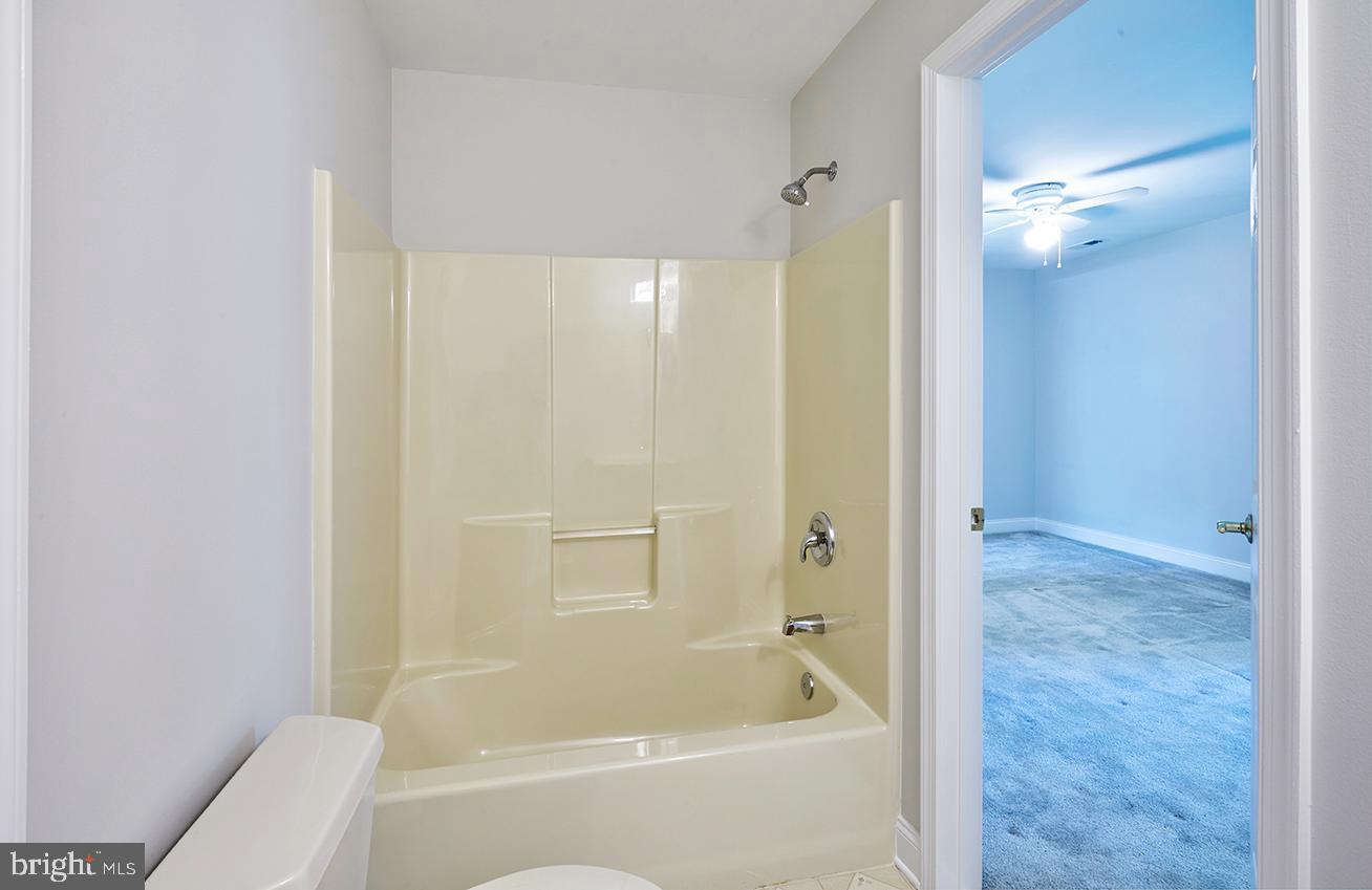 2582 Monmouth Road Jobstown, NJ 08041 - Photo 56 of 65 a bathroom with a bathtub and a shower