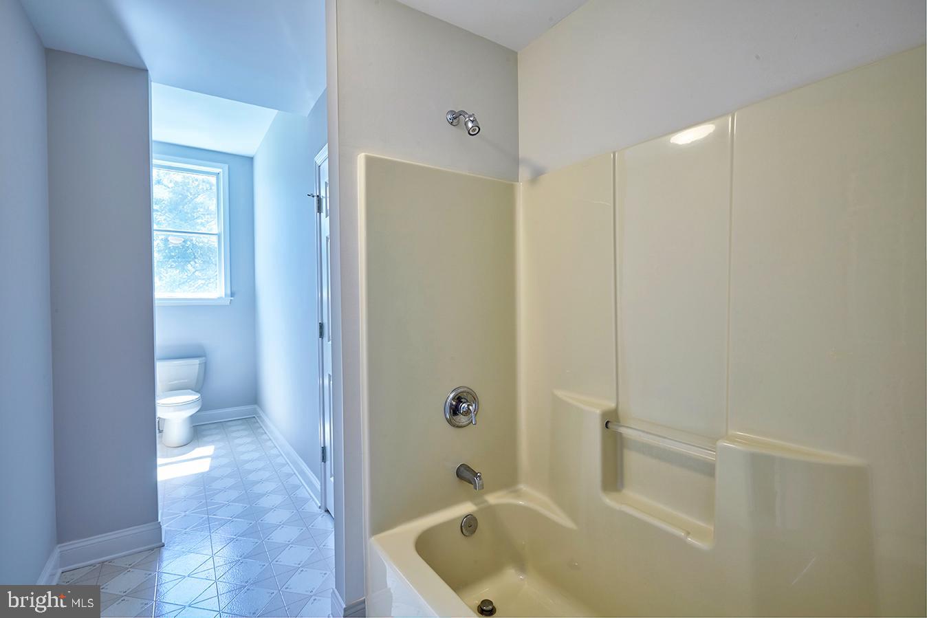 2582 Monmouth Road Jobstown, NJ 08041 - Photo 62 of 65 a bathroom with a tub shower and sink