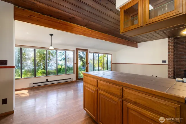 a kitchen with sink a stove and cabinets