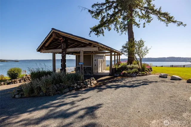 a view of an ocean house yard and ocean view