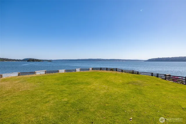 a view of a swimming pool with a table and chairs