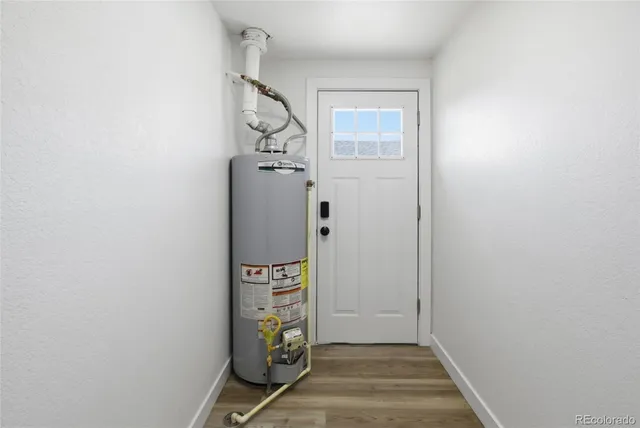 a view of an entryway with wooden floor