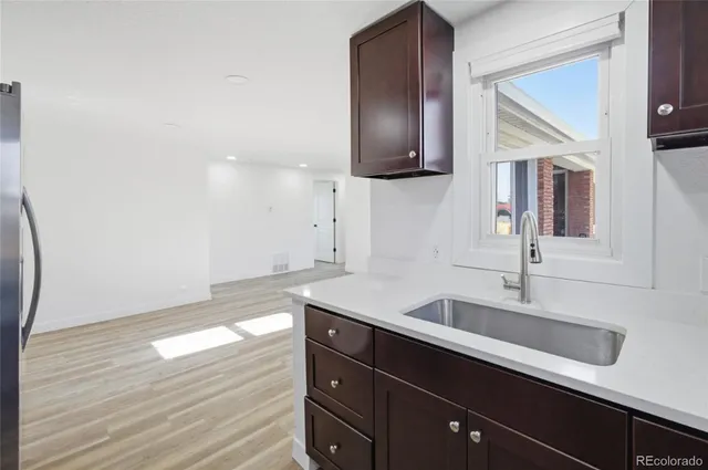 a kitchen with a sink and cabinets