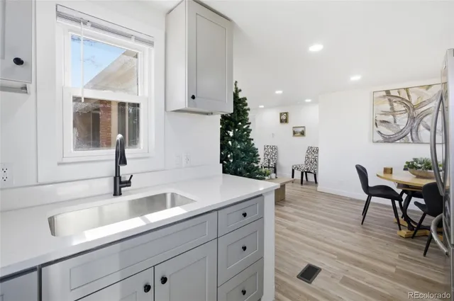 a kitchen with sink and cabinets