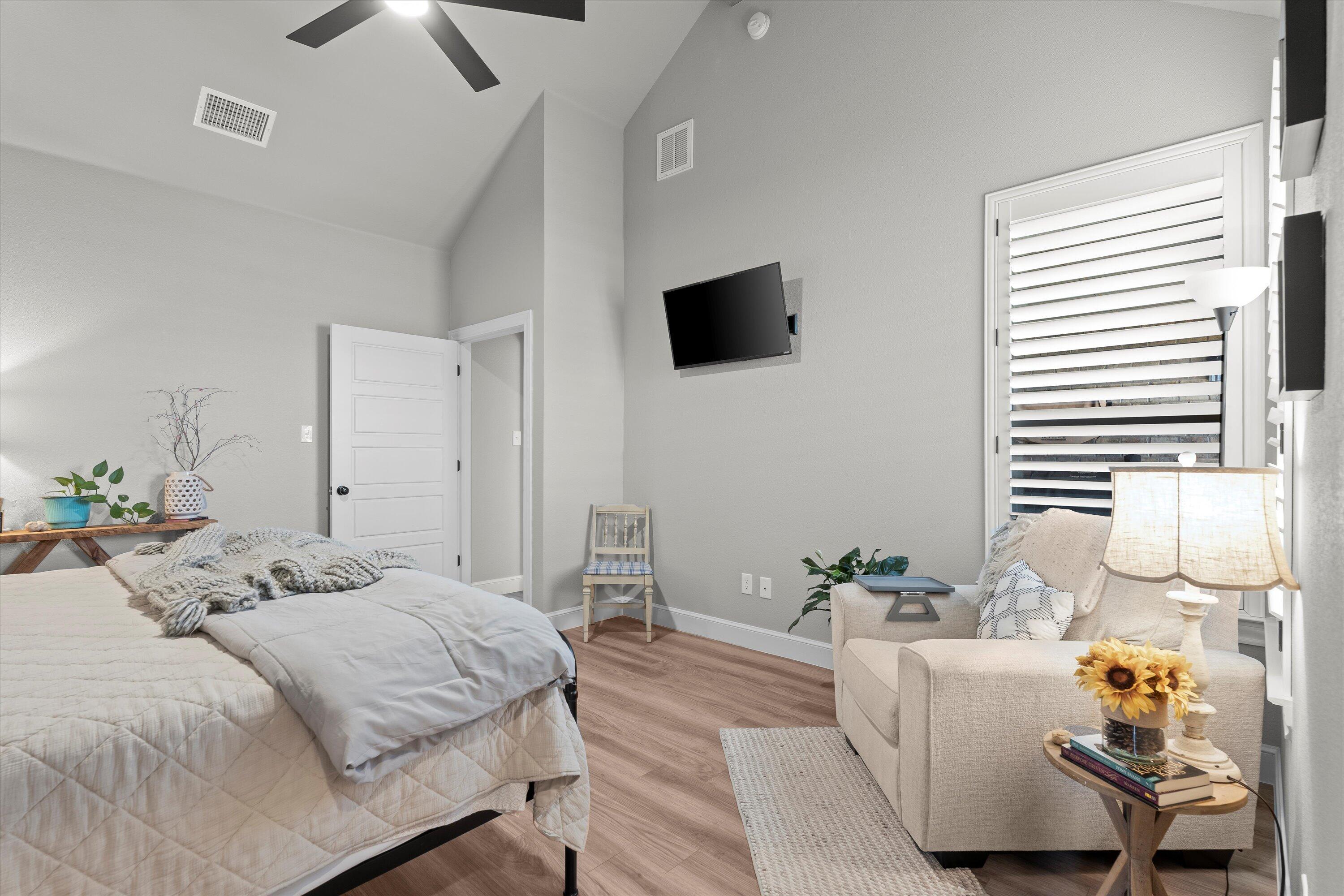 7002 103rd Street Lubbock, TX 79424 - Photo 15 of 35 a bedroom with a bed and a flat screen tv