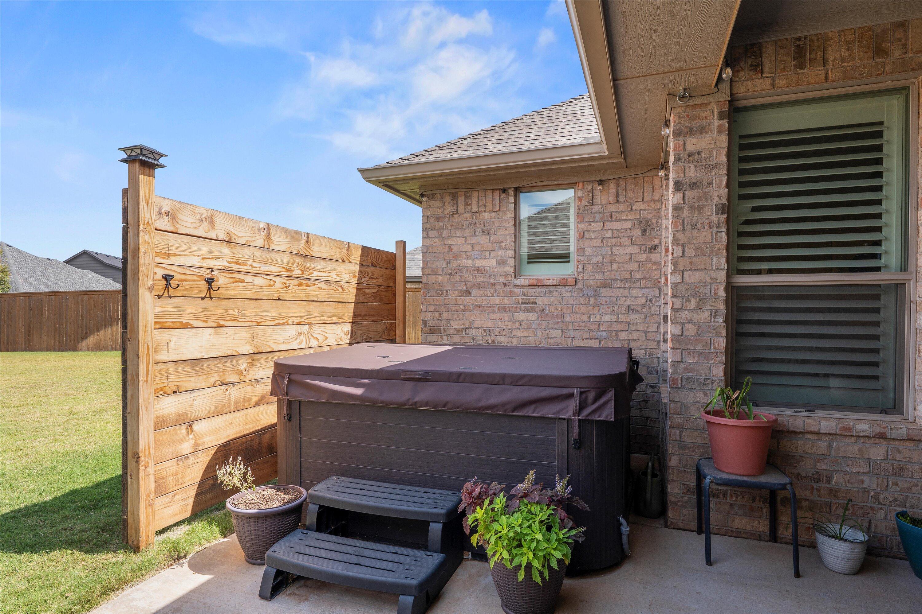 7002 103rd Street Lubbock, TX 79424 - Photo 31 of 35 a front view of a house with outdoor seating