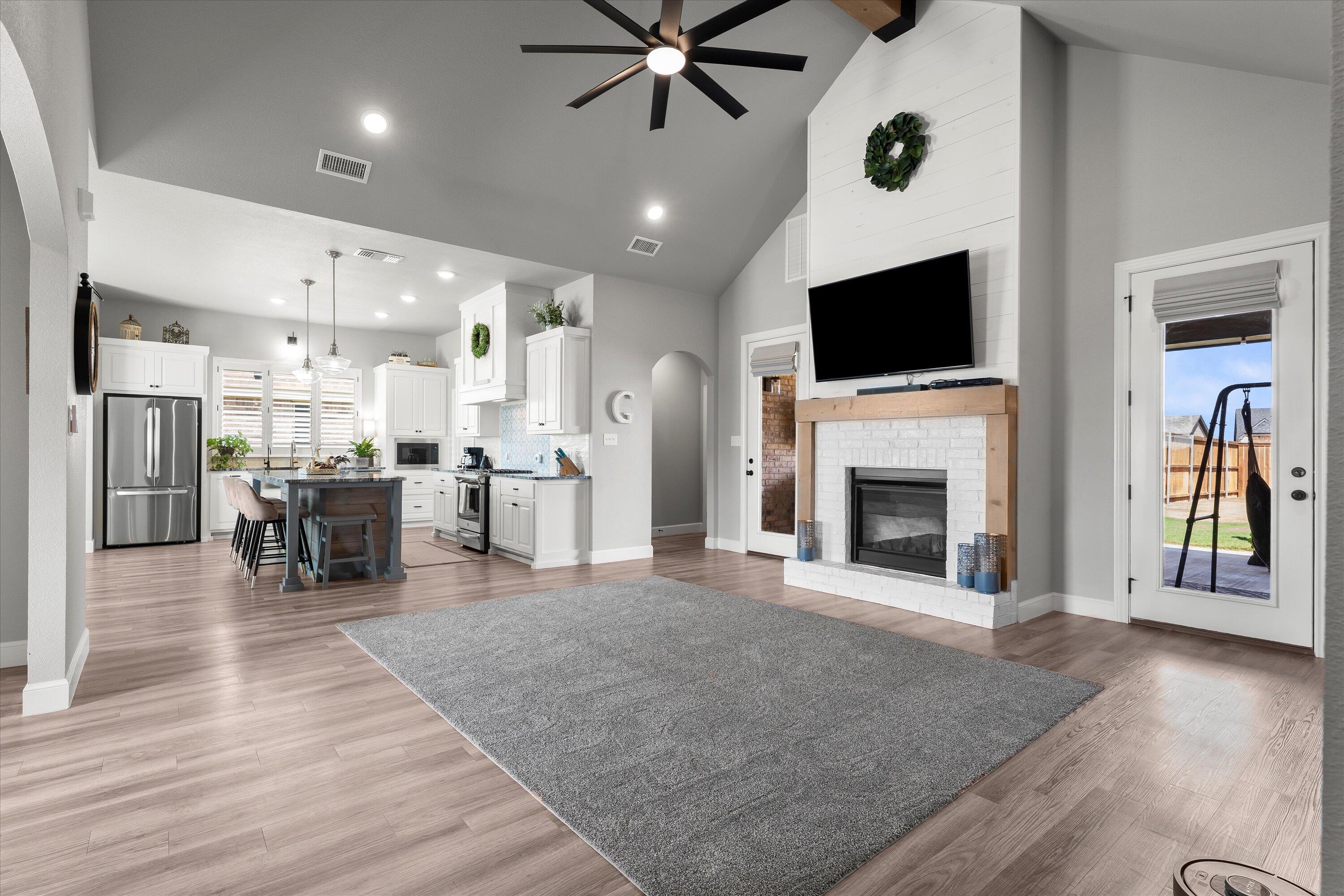 7002 103rd Street Lubbock, TX 79424 - Photo 6 of 35 a living room with furniture and a fireplace