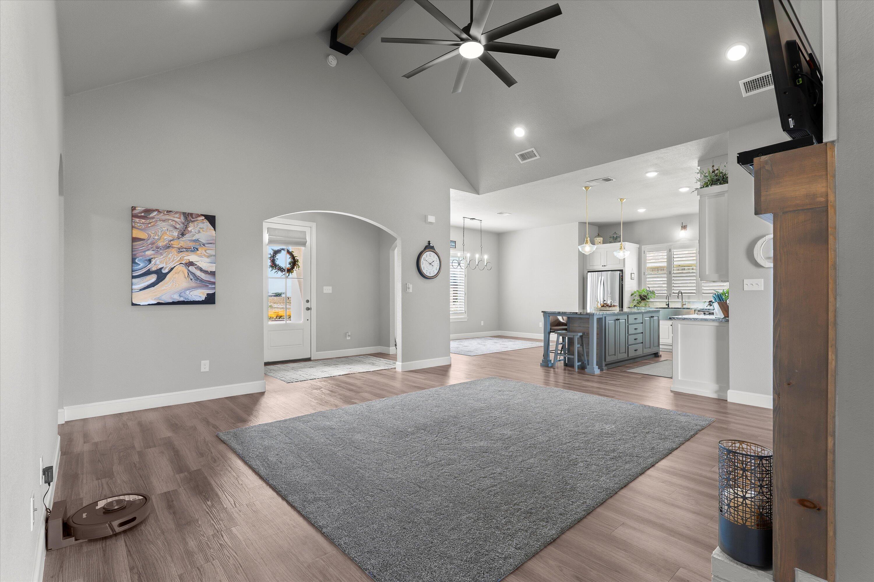 7002 103rd Street Lubbock, TX 79424 - Photo 7 of 35 a living room with furniture and kitchen view