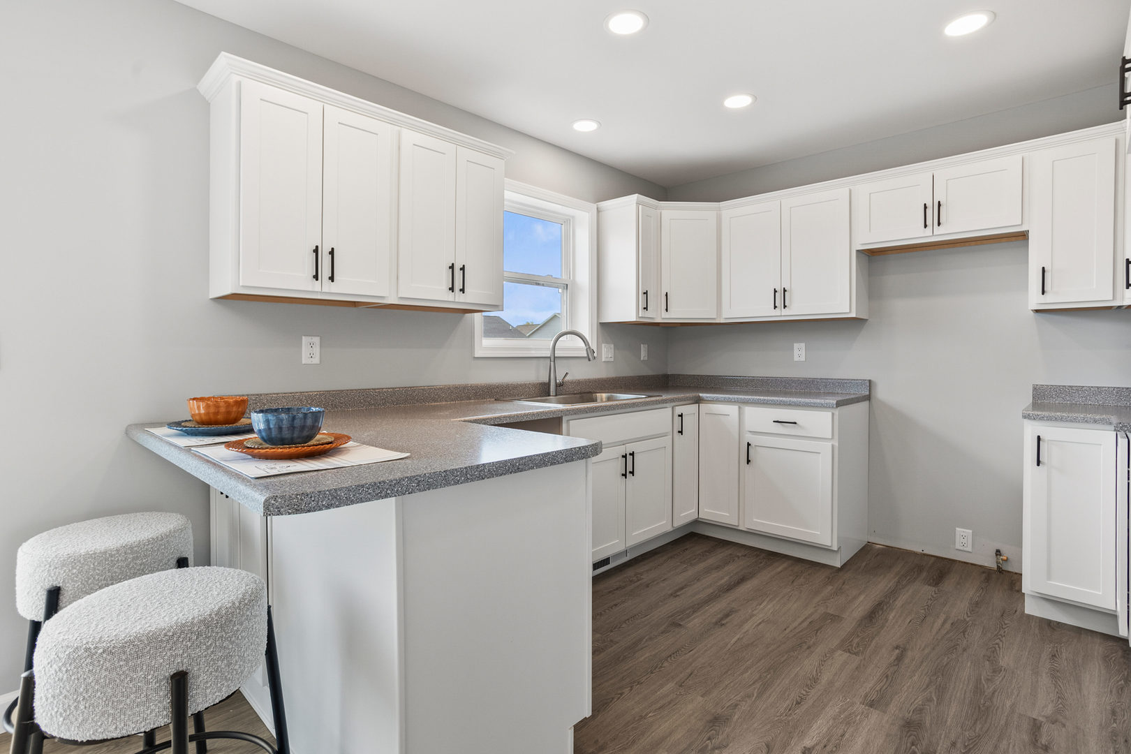 508 Patterson Drive Bloomington, IL 61701 - Photo 11 of 33 a kitchen with a sink cabinets and wooden floor