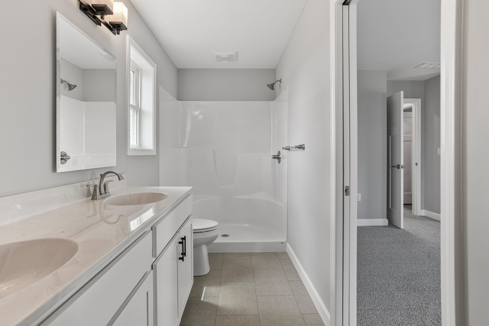 508 Patterson Drive Bloomington, IL 61701 - Photo 21 of 33 a bathroom with a sink a toilet and shower
