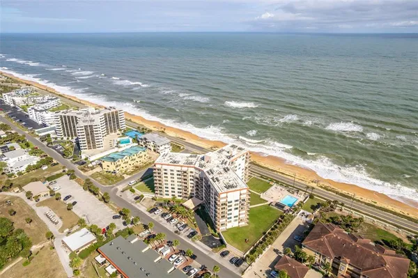 a view of a city with an ocean view