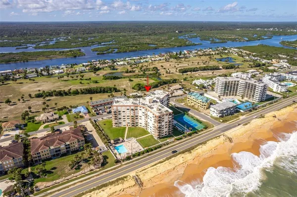 an aerial view of residential building with outdoor space
